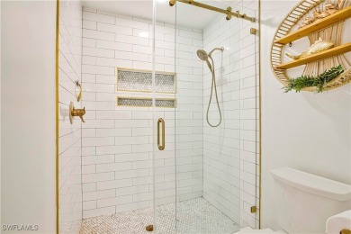This fully remodeled, turnkey first-floor residence in the on Club at Pelican Bay Golf Course in Florida - for sale on GolfHomes.com, golf home, golf lot