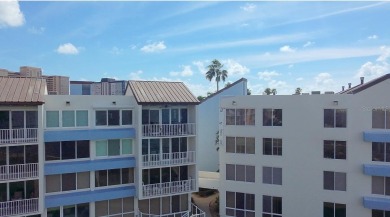 Two-bedroom, two-bath penthouse condo with extra room/office at on Isla Del Sol Yacht and Country Club in Florida - for sale on GolfHomes.com, golf home, golf lot