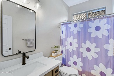 This delightful single-story residence offers 3 spacious on The Golf Club At Johnson Ranch in Arizona - for sale on GolfHomes.com, golf home, golf lot