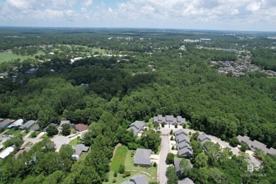 Nestled under the trees in a tranquil setting just off Ft Morgan on The Golf Club of the Wharf in Alabama - for sale on GolfHomes.com, golf home, golf lot