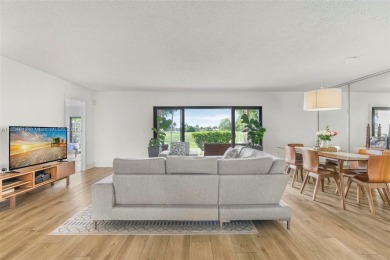 Stunning corner 2/2 townhome located in the desirable Country on Country Club of Miami in Florida - for sale on GolfHomes.com, golf home, golf lot