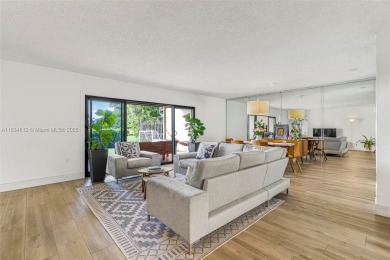 Stunning corner 2/2 townhome located in the desirable Country on Country Club of Miami in Florida - for sale on GolfHomes.com, golf home, golf lot