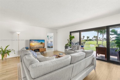 Stunning corner 2/2 townhome located in the desirable Country on Country Club of Miami in Florida - for sale on GolfHomes.com, golf home, golf lot