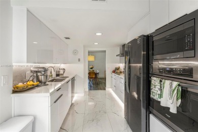 Stunning corner 2/2 townhome located in the desirable Country on Country Club of Miami in Florida - for sale on GolfHomes.com, golf home, golf lot