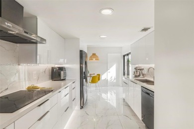 Stunning corner 2/2 townhome located in the desirable Country on Country Club of Miami in Florida - for sale on GolfHomes.com, golf home, golf lot