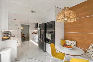 Stunning corner 2/2 townhome located in the desirable Country on Country Club of Miami in Florida - for sale on GolfHomes.com, golf home, golf lot