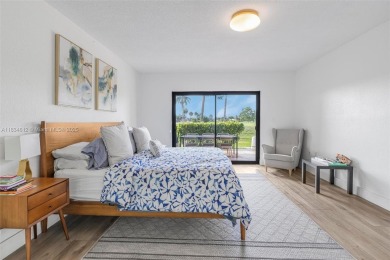 Stunning corner 2/2 townhome located in the desirable Country on Country Club of Miami in Florida - for sale on GolfHomes.com, golf home, golf lot