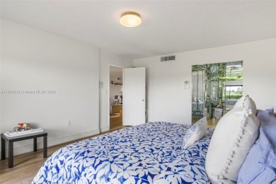 Stunning corner 2/2 townhome located in the desirable Country on Country Club of Miami in Florida - for sale on GolfHomes.com, golf home, golf lot