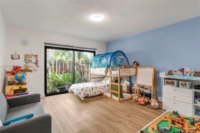 Stunning corner 2/2 townhome located in the desirable Country on Country Club of Miami in Florida - for sale on GolfHomes.com, golf home, golf lot