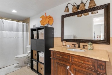 Stunning corner 2/2 townhome located in the desirable Country on Country Club of Miami in Florida - for sale on GolfHomes.com, golf home, golf lot