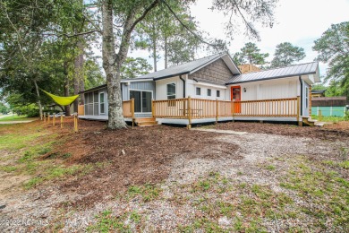 This newly updated 3BD/2BA home is on a corner lot with direct on Oak Island Golf Club in North Carolina - for sale on GolfHomes.com, golf home, golf lot