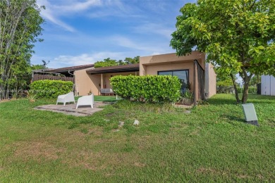 Stunning corner 2/2 townhome located in the desirable Country on Country Club of Miami in Florida - for sale on GolfHomes.com, golf home, golf lot