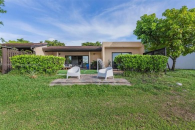 Stunning corner 2/2 townhome located in the desirable Country on Country Club of Miami in Florida - for sale on GolfHomes.com, golf home, golf lot
