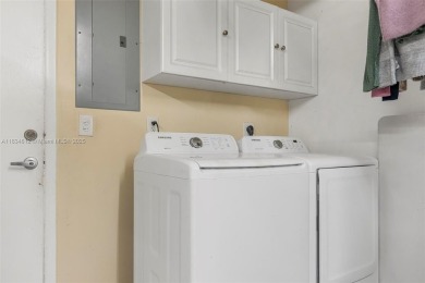 Stunning corner 2/2 townhome located in the desirable Country on Country Club of Miami in Florida - for sale on GolfHomes.com, golf home, golf lot