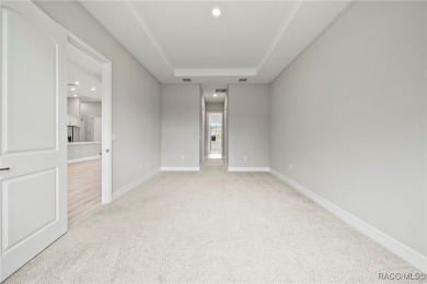 2025 NEW BUILD, this custom updated Genesis Model from Commence on Southern Woods Golf Club in Florida - for sale on GolfHomes.com, golf home, golf lot