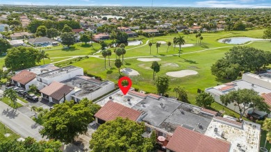 Stunning corner 2/2 townhome located in the desirable Country on Country Club of Miami in Florida - for sale on GolfHomes.com, golf home, golf lot