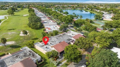 Stunning corner 2/2 townhome located in the desirable Country on Country Club of Miami in Florida - for sale on GolfHomes.com, golf home, golf lot