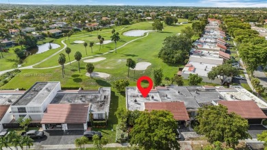 Stunning corner 2/2 townhome located in the desirable Country on Country Club of Miami in Florida - for sale on GolfHomes.com, golf home, golf lot