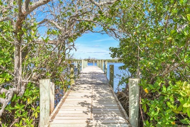 Enjoy stunning golf-course views from this updated on Miles Grant Country Club in Florida - for sale on GolfHomes.com, golf home, golf lot