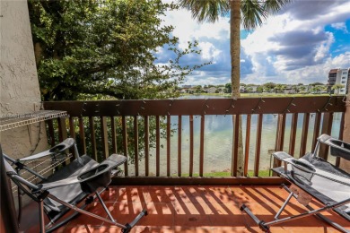 Indulge in the epitome of lakeside living with this exquisite on Fontainebleau Golf Course in Florida - for sale on GolfHomes.com, golf home, golf lot