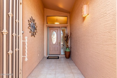 Impeccably maintained 2-bedroom, 2-bathroom Doral model home on Tuscany Falls At Pebble Creek in Arizona - for sale on GolfHomes.com, golf home, golf lot