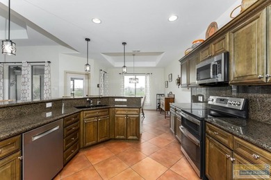 Effortless and elegant golf-course living in the SPI Golf on South Padre Island Golf Club in Texas - for sale on GolfHomes.com, golf home, golf lot