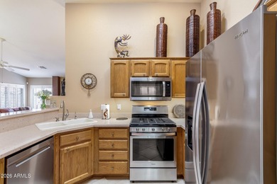 Impeccably maintained 2-bedroom, 2-bathroom Doral model home on Tuscany Falls At Pebble Creek in Arizona - for sale on GolfHomes.com, golf home, golf lot