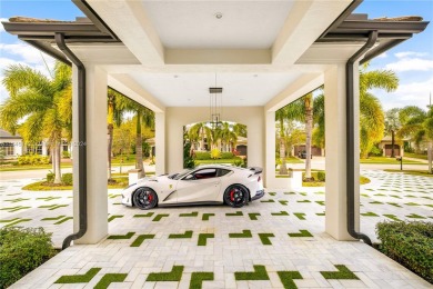 Stunning Parkland Contemporary-style estate with amazing lake on Heron Bay Golf Club in Florida - for sale on GolfHomes.com, golf home, golf lot