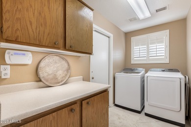 Impeccably maintained 2-bedroom, 2-bathroom Doral model home on Tuscany Falls At Pebble Creek in Arizona - for sale on GolfHomes.com, golf home, golf lot