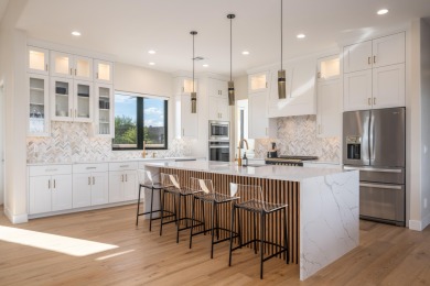 Experience refined desert living in this stunning custom home on The Ledges Golf Club in Utah - for sale on GolfHomes.com, golf home, golf lot