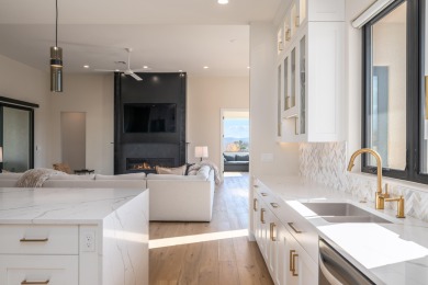 Experience refined desert living in this stunning custom home on The Ledges Golf Club in Utah - for sale on GolfHomes.com, golf home, golf lot