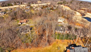 This fantastic half-acre lot offers an exceptional opportunity on Rock Barn Golf and Spa in North Carolina - for sale on GolfHomes.com, golf home, golf lot