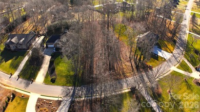 This fantastic half-acre lot offers an exceptional opportunity on Rock Barn Golf and Spa in North Carolina - for sale on GolfHomes.com, golf home, golf lot