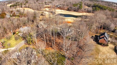 This fantastic half-acre lot offers an exceptional opportunity on Rock Barn Golf and Spa in North Carolina - for sale on GolfHomes.com, golf home, golf lot