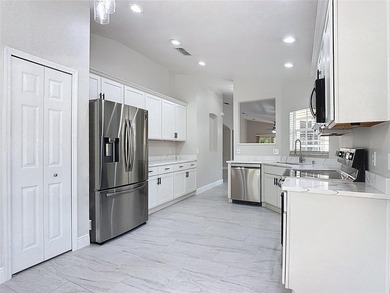 Some photos are virtually  staged. ***See the FULL LENGTH VIDEO on Stonegate Golf Club in Florida - for sale on GolfHomes.com, golf home, golf lot