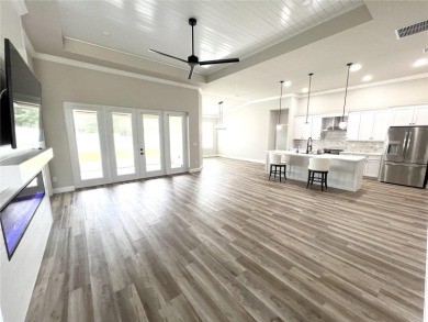 Built in 2023! This 4 bedroom, 3 bathroom, 3 car garage home has on The Grand Club - Pine Lakes Course in Florida - for sale on GolfHomes.com, golf home, golf lot