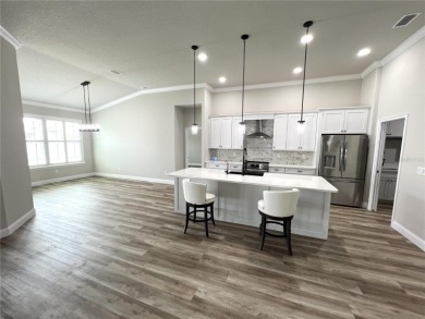 Built in 2023! This 4 bedroom, 3 bathroom, 3 car garage home has on The Grand Club - Pine Lakes Course in Florida - for sale on GolfHomes.com, golf home, golf lot