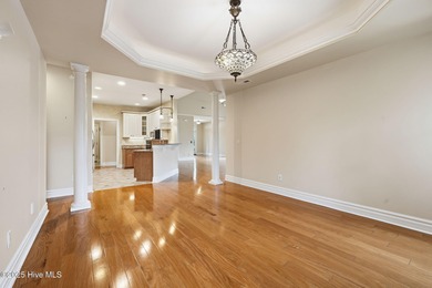 Welcome to your beautiful brick home overlooking a peaceful pond on Cape Fear National At Brunswick Forest in North Carolina - for sale on GolfHomes.com, golf home, golf lot