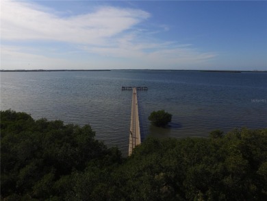 Experience breathtaking sunsets and panoramic views from this on Terra Ceia Golf and Country Club in Florida - for sale on GolfHomes.com, golf home, golf lot