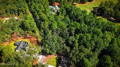 Nestled in the serene community of Seven Lakes South, this prime on Seven Lakes Country Club in North Carolina - for sale on GolfHomes.com, golf home, golf lot