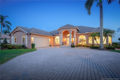 As soon as you enter this home, you are welcomed by the on Santa Lucia River Club in Florida - for sale on GolfHomes.com, golf home, golf lot