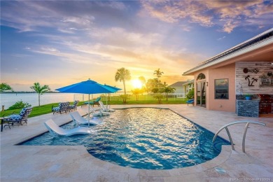 As soon as you enter this home, you are welcomed by the on Santa Lucia River Club in Florida - for sale on GolfHomes.com, golf home, golf lot