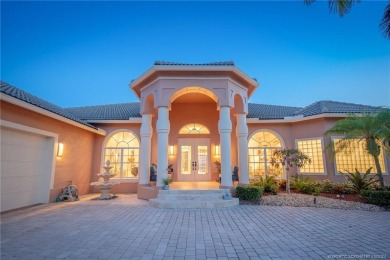 As soon as you enter this home, you are welcomed by the on Santa Lucia River Club in Florida - for sale on GolfHomes.com, golf home, golf lot