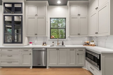 Experience unparalleled lakeside living at 147 Brushwood Ct on Rayburn Country Club in Texas - for sale on GolfHomes.com, golf home, golf lot