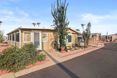 Lovely 2 bed, 2 bath home with an enclosed AZ room adding 250 sq on Apache Creek Golf Club in Arizona - for sale on GolfHomes.com, golf home, golf lot