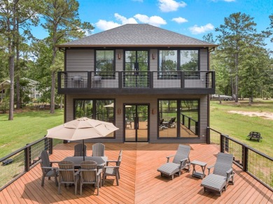 Experience unparalleled lakeside living at 147 Brushwood Ct on Rayburn Country Club in Texas - for sale on GolfHomes.com, golf home, golf lot