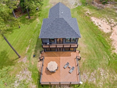 Experience unparalleled lakeside living at 147 Brushwood Ct on Rayburn Country Club in Texas - for sale on GolfHomes.com, golf home, golf lot