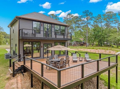 Experience unparalleled lakeside living at 147 Brushwood Ct on Rayburn Country Club in Texas - for sale on GolfHomes.com, golf home, golf lot