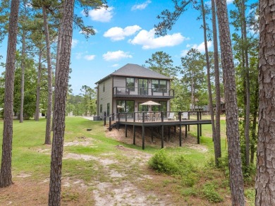 Experience unparalleled lakeside living at 147 Brushwood Ct on Rayburn Country Club in Texas - for sale on GolfHomes.com, golf home, golf lot