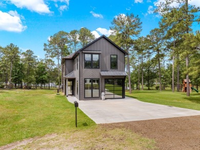 Experience unparalleled lakeside living at 147 Brushwood Ct on Rayburn Country Club in Texas - for sale on GolfHomes.com, golf home, golf lot